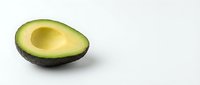 Halved avocado with pit removed, isolated on white background, ready for food and nutrition design projects.