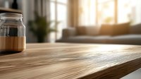 Glass jar on wooden table edge with soft morning sunlight streaming through window, creating warm atmosphere in minimalist living room interior.