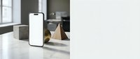 Modern smartphone mockup with blank white screen on marble kitchen counter for app presentation and digital marketing campaigns.