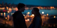 Romantic couple silhouette against city lights at dusk, intimate moment overlooking urban skyline during blue hour for dating and relationship concepts.