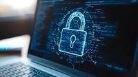 Glowing digital padlock surrounded by computer code on laptop screen represents cybersecurity and data protection in modern digital environment.