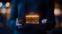 Magical glowing gift box floating between hands against dark background with bokeh lights, sparkling particles creating ethereal holiday atmosphere.