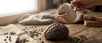 Pouring hot water over freshly ground coffee beans into a round filter, creating aromatic brew for morning beverage preparation and caffeine enjoyment.