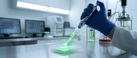 Laboratory scientist using pipette with green fluorescent sample in modern research facility for biotechnology experiments and chemical analysis.