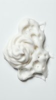 White creamy skincare product texture with swirled application and porous foam structure, isolated on white background for cosmetic packaging and beauty design use.