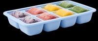 Colorful frozen fruit puree cubes in a blue silicone tray, isolated on transparent background. Great for clipart, stickers, t-shirt design, and print on demand.