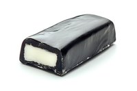 Dark chocolate covered vanilla cream candy bar with bite showing soft white filling on white background, isolated confectionery product photography.