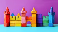 Colorful wooden toy castle blocks arranged on turquoise surface against purple background, featuring bright red, yellow, and blue towers with geometric shapes and arched gateway.