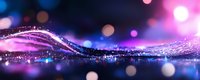 Magical glowing wave with sparkles and bokeh lights against dark background creates dreamy atmosphere in purple and blue colors. Abstract motion blur effect.