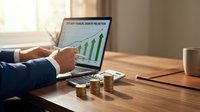 Business professional analyzing financial growth chart on laptop with coin stacks representing investment success and profit increase on wooden desk.