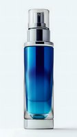 Elegant blue glass cosmetic spray bottle with silver pump dispenser on white background, isolated luxury skincare packaging mockup for beauty product design.
