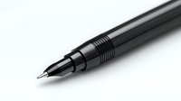 Black mechanical pencil with metallic grip detail on white background isolated for design projects and office supply concepts.