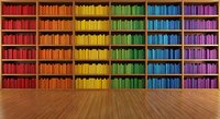 Rainbow colored books arranged by hue on wooden library shelves creating vibrant spectrum display for education and learning concepts.