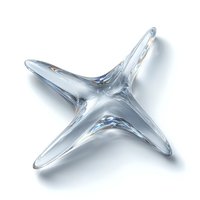 Clear glass four-pointed star shape on white background, featuring smooth curves and light reflections. Isolated object for luxury design elements.