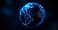 Digital globe with glowing blue network connections and illuminated city lights showing Earth's continents against dark background, representing global connectivity.