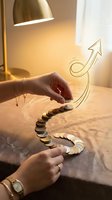 Female hands arranging coins in upward arrow formation showing financial growth and investment success concept for business presentations.