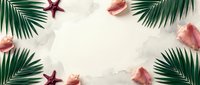 Tropical summer frame with palm leaves, seashells and starfish on white sand beach background for vacation and travel design projects.
