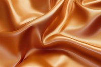 Luxurious copper satin fabric with elegant folds and smooth waves creates rich texture and flowing movement. Soft lighting enhances metallic sheen and depth.