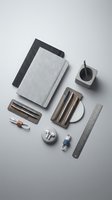 Modern minimalist office supplies and stationery items arranged on clean white background for professional workspace design and productivity concepts.