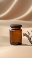 Amber glass jar with wooden lid on beige background with soft shadows and minimal dried plant decoration, suitable for cosmetic product mockup.