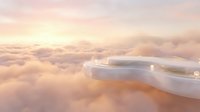 Commercial airplane wing flying above fluffy clouds during golden hour sunset with warm pink and orange sky creating dreamy aviation atmosphere.