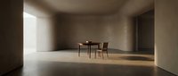 Minimalist interior space with wooden table and chairs bathed in natural sunlight from large window, empty concrete room for modern design projects.