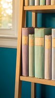 Vintage books with colorful spines arranged on wooden bookshelf in warm sunlight creating cozy reading atmosphere for home library interior design.