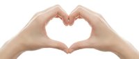 Female hands forming heart shape gesture on white background isolated for love romance and affection concepts in healthcare wellness and relationship designs.