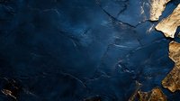 Cracked dark blue paint peeling off weathered surface revealing rustic brown underneath creating abstract textured background for vintage design projects.