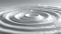 Liquid water drop creating concentric ripples in calm surface with smooth circular waves spreading outward in monochrome grayscale tones.