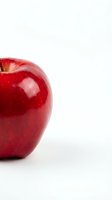 Fresh red apple isolated on white background with copy space for healthy eating and nutrition concepts.