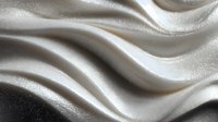 Elegant cream-colored satin fabric with smooth flowing waves and gentle folds creating a luxurious textured surface for fashion or interior design backgrounds.