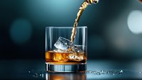 Whiskey pouring into rocks glass with ice cubes, creating dynamic splash on dark background with bokeh lights, luxury beverage photography.