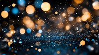 Magical glowing bokeh lights on dark background with blue and golden sparkles creating dreamy atmospheric effect for festive designs and holiday projects.