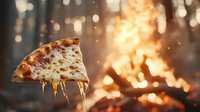 Hot melted cheese stretches from slice of pepperoni pizza against blurred fiery background with glowing bokeh lights creating dramatic food photography effect.