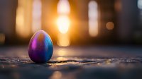 Metallic purple and blue Easter egg on textured surface with warm sunset bokeh background creates magical holiday atmosphere and festive mood.