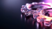 Glowing ice cubes with pink and orange light reflections on dark background create dramatic atmosphere for beverage and cocktail photography.