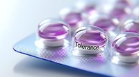 Purple transparent capsules with word "Tolerance" on blister pack, representing pharmaceutical concept for medical or healthcare marketing.