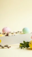 Easter greeting card mockup with colorful eggs and spring decorations on neutral background for holiday design projects.
