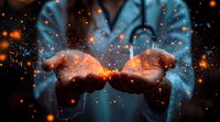 Glowing magical sparkles float above cupped hands against dark background, creating mystical atmosphere with orange light particles and blue ethereal glow.