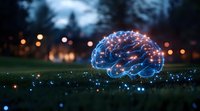 Glowing digital brain hologram on grass at night with bokeh lights, representing artificial intelligence and cognitive technology advancement in nature setting.