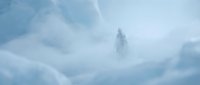 Solitary figure standing amid thick fog and mist in mountainous terrain, evoking isolation and mystery. Suitable for atmospheric storytelling, adventure narratives, and contemplative design projects.