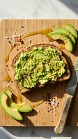 Healthy avocado toast on whole grain bread with fresh sliced avocado, seeds and spices on bamboo cutting board for nutritious breakfast or snack meal.
