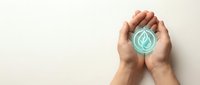 Two hands holding a glowing turquoise water droplet icon against a light background, representing environmental conservation, sustainability, and eco-friendly practices.