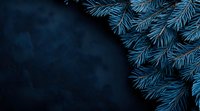 Glowing blue spruce pine branches against dark night background create magical winter holiday atmosphere, corner composition for seasonal designs.