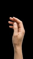 Caucasian male hand isolated on transparent background with fingers slightly curved in a grasping gesture, ready for design use on t-shirts, clipart, stickers, and print-on-demand products.