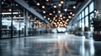 Blurred modern office lobby with bokeh lights and reflective floor creating atmospheric business environment for corporate presentations and professional concepts.