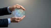 Businessman holding glowing digital symbol between hands against gray background, representing technology innovation, business growth, and corporate success for presentations.
