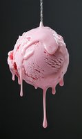 Pink ice cream scoop melting and dripping on dark background for dessert and summer treat advertising concepts.