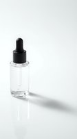 Clear glass dropper bottle with black pipette cap on white background, isolated and ready for cosmetic, skincare, essential oil, or serum product packaging design.